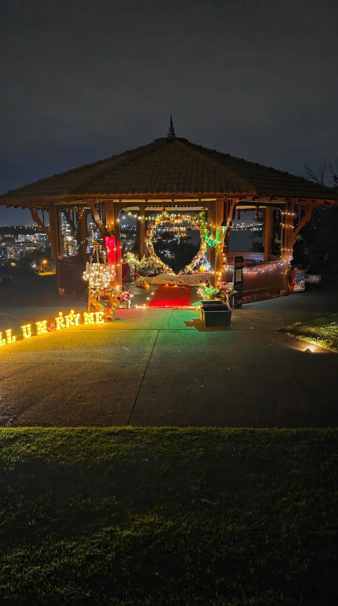 Proposal styling at an illuminated gazebo overlooking Perth